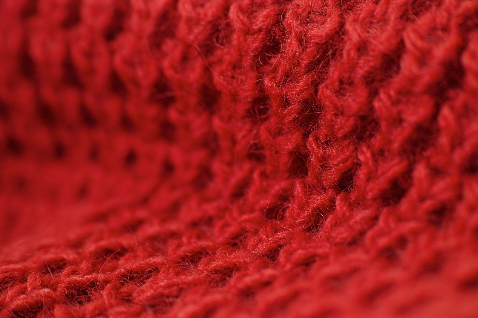 Textil de punto rojo tejido en primer plano